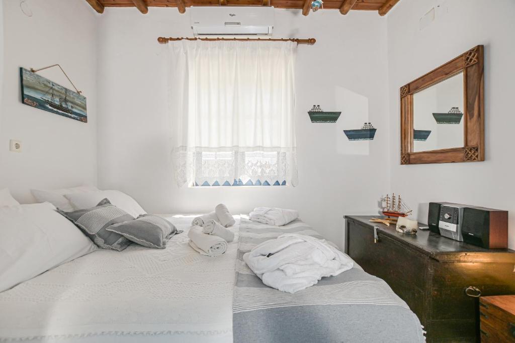 A bed or beds in a room at Naxos Pantheon House Panoramic View