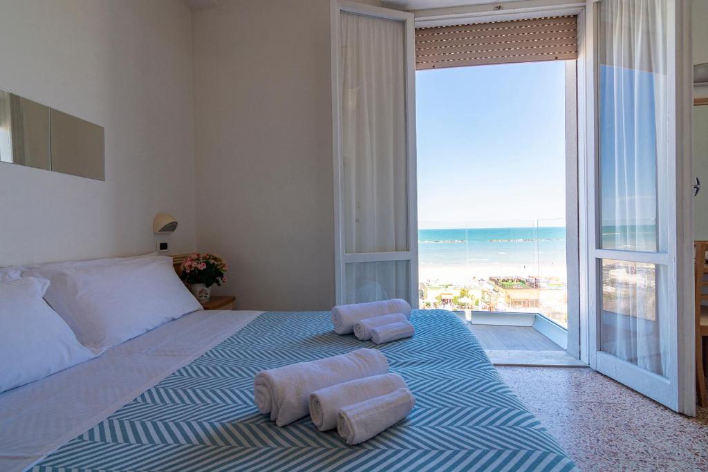 Postel nebo postele na pokoji v ubytování Hotel Atlas