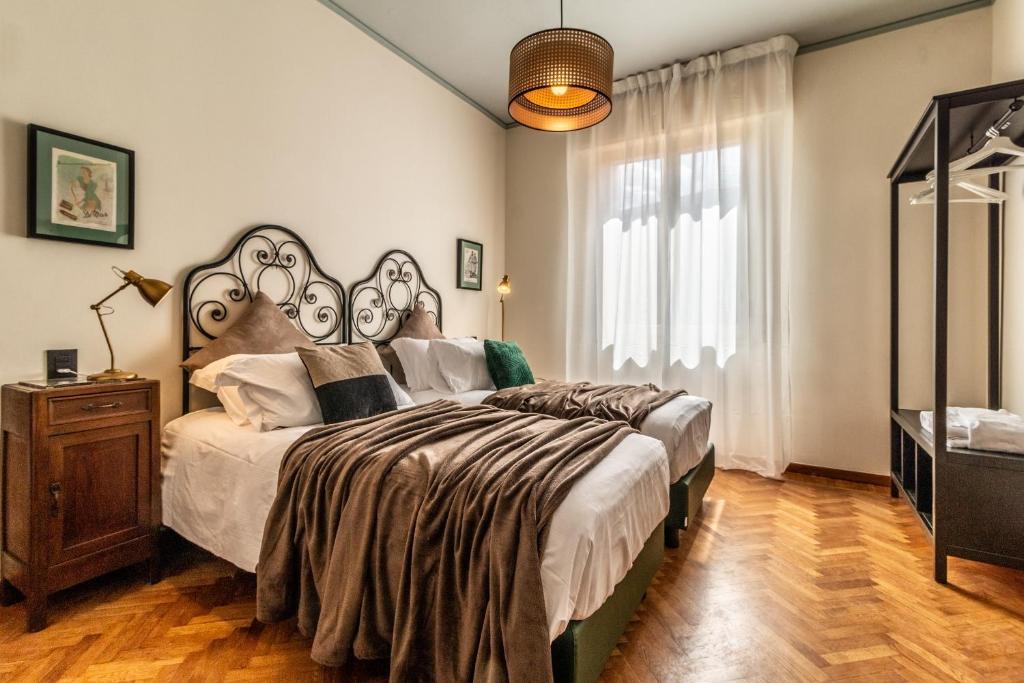 A bed or beds in a room at Dimora Vintage San Tommaso by Wonderful Italy