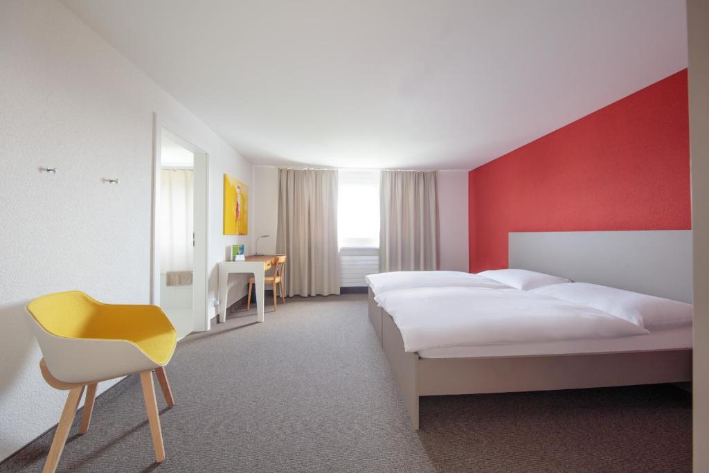 Postel nebo postele na pokoji v ubytování Le Domaine (Swiss Lodge)