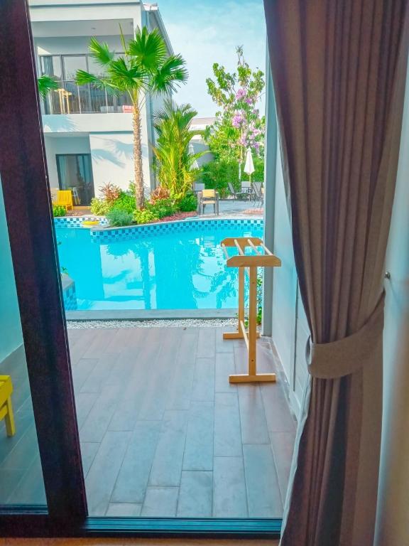 Bazén v ubytování HATCHAO HERITAGE BEACH FRONT RESORT nebo v jeho okolí