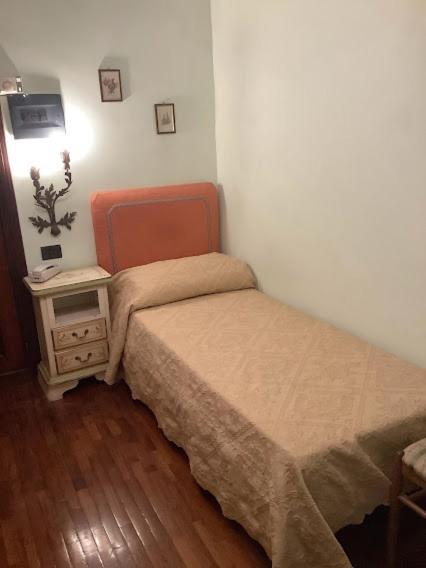 Postel nebo postele na pokoji v ubytování Hotel Savona