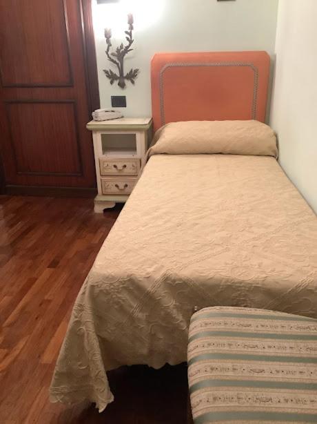 Postel nebo postele na pokoji v ubytování Hotel Savona