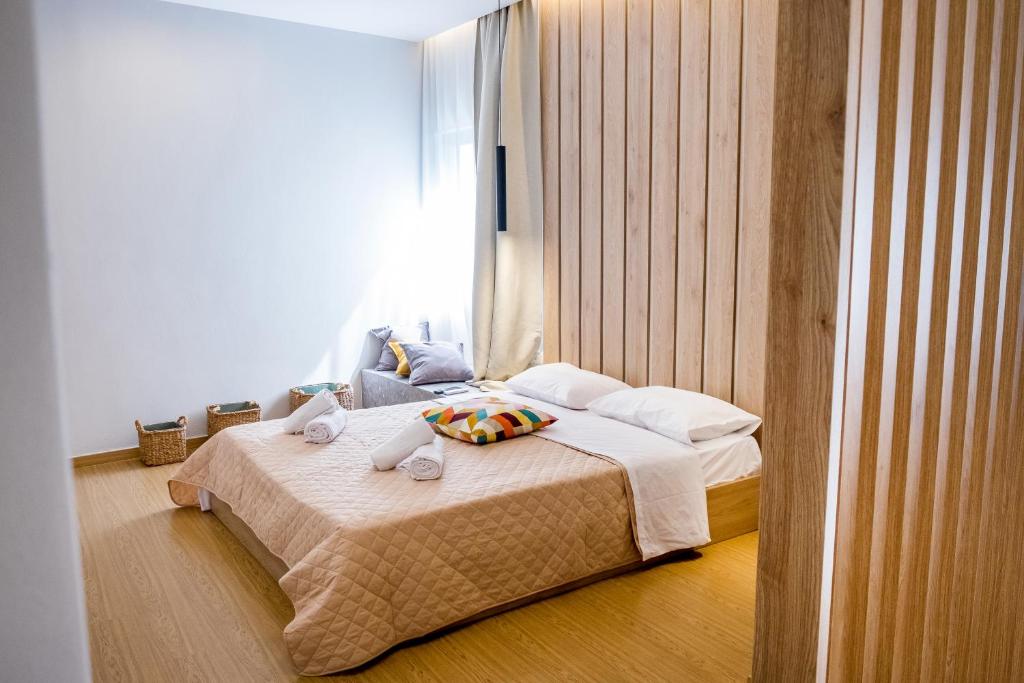 A bed or beds in a room at Evangeline Maisons