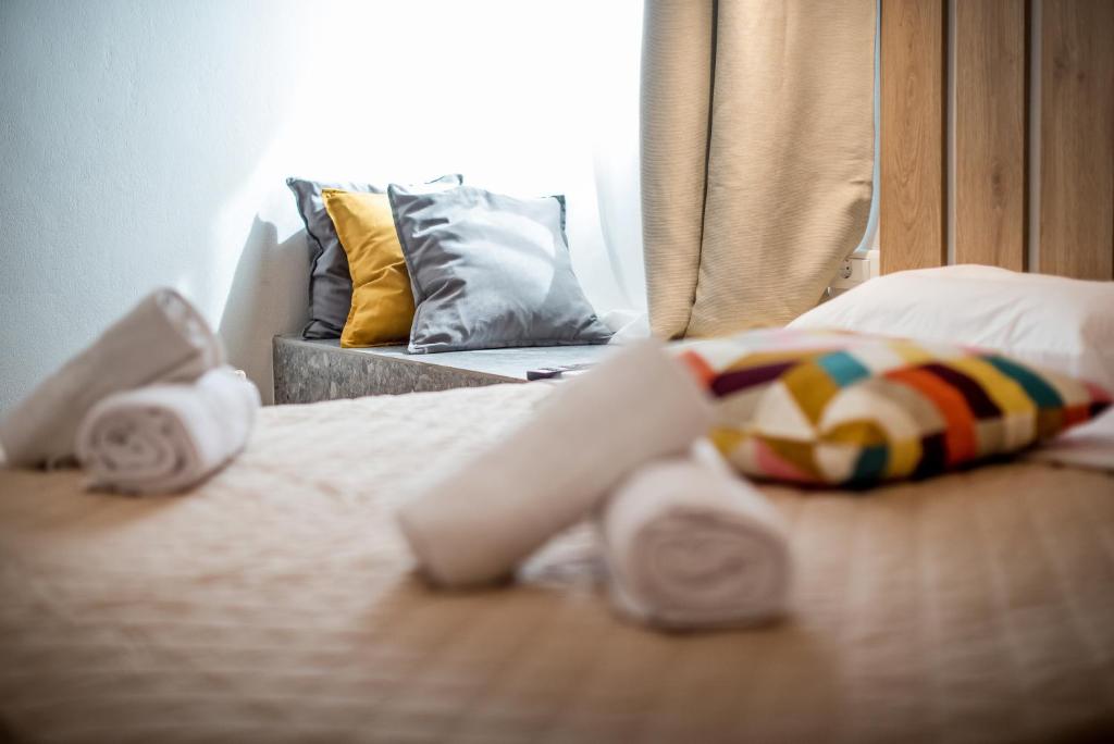 A bed or beds in a room at Evangeline Maisons