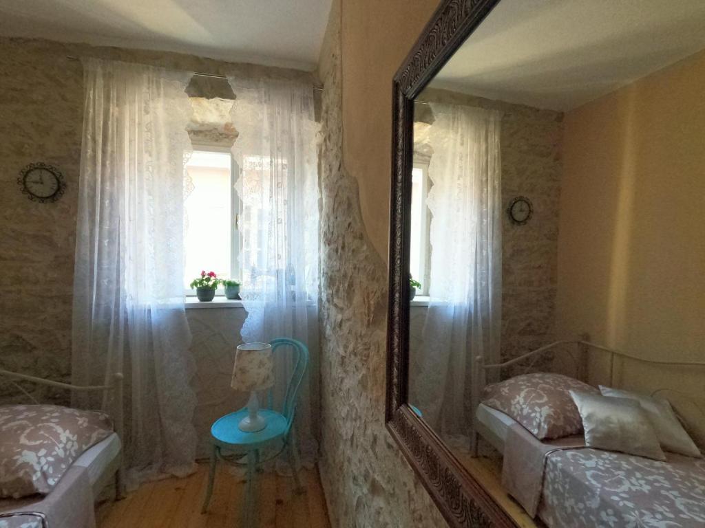 Postel nebo postele na pokoji v ubytování Stone House Hedonia
