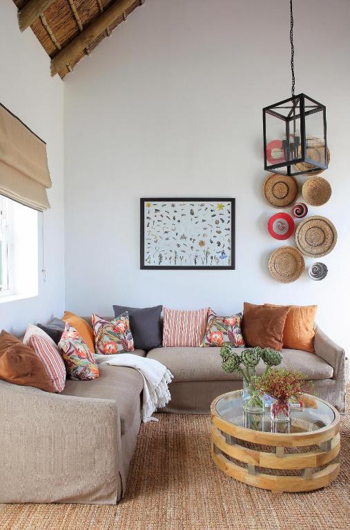 a living room with a couch and a table at Penhill Farm Fruit Barn in Nuy