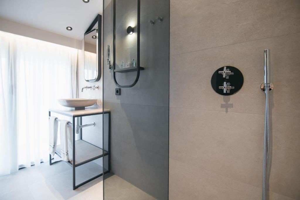 a bathroom with a shower and a sink at MYR Puerta Serranos in Valencia