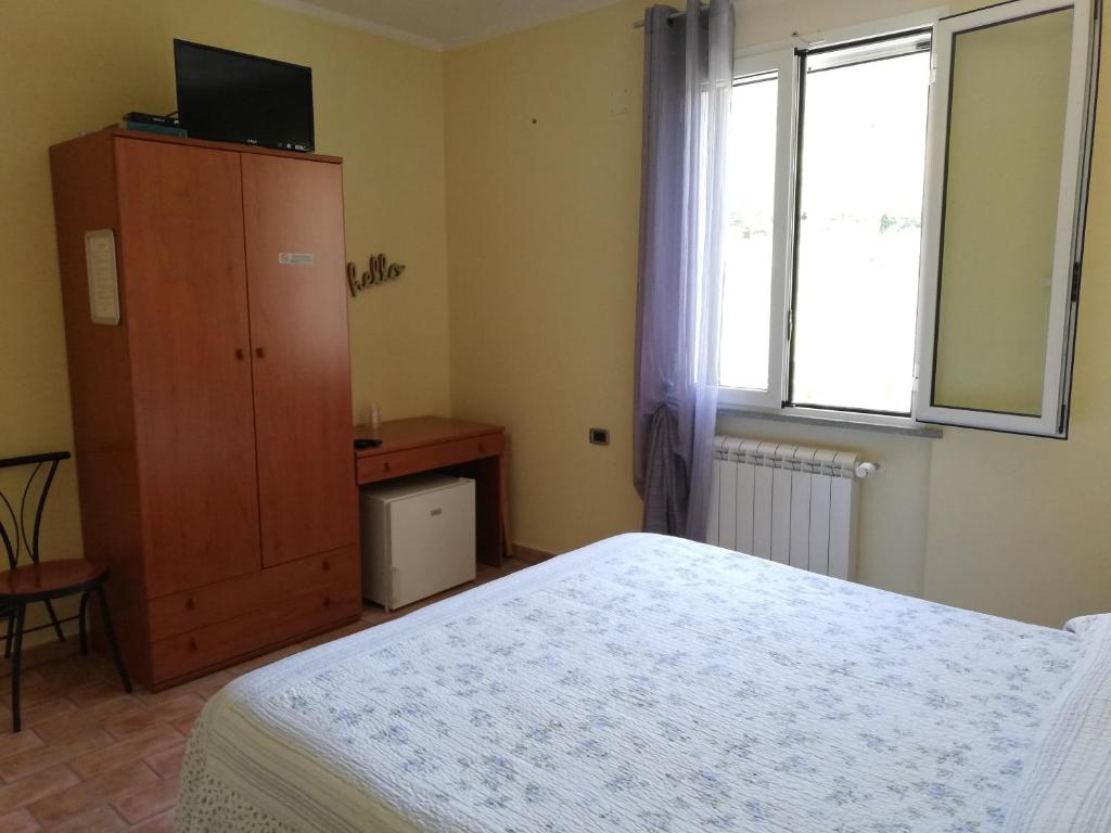 Łóżko lub łóżka w pokoju w obiekcie Locanda Cà de Rusitta