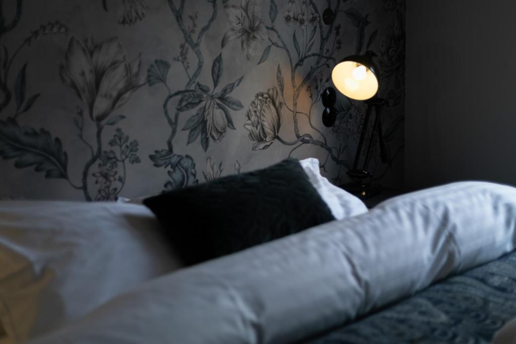Postel nebo postele na pokoji v ubytování Hotel Siglunes