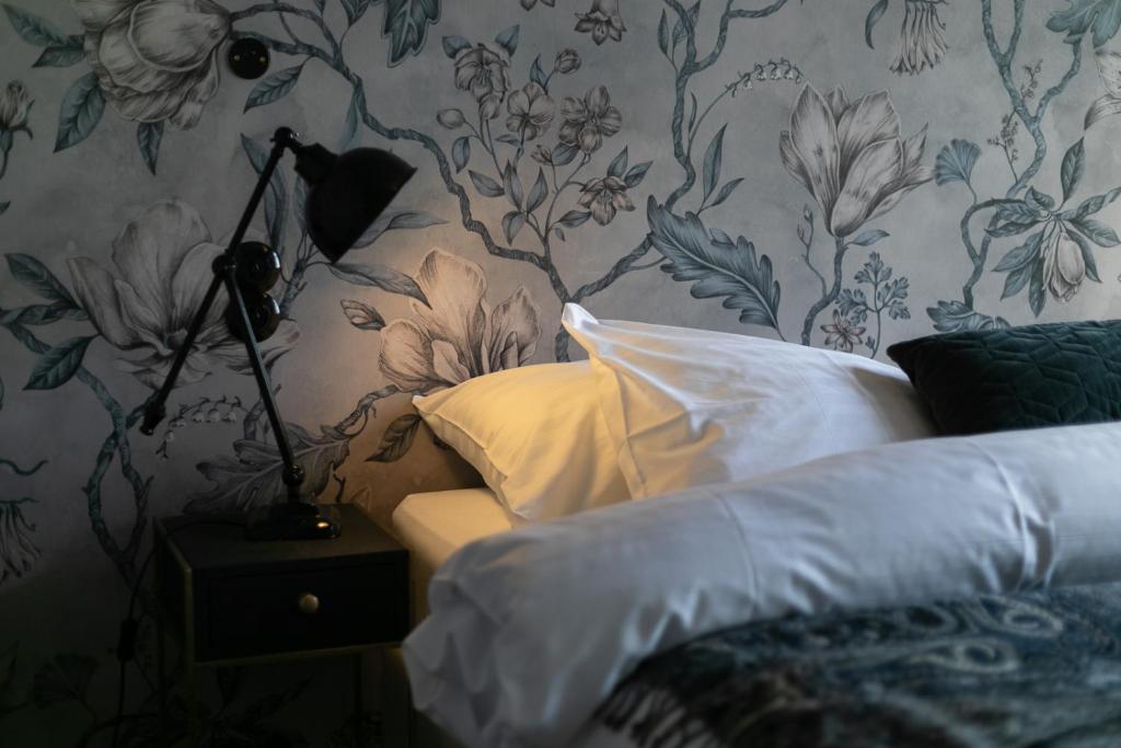 Postel nebo postele na pokoji v ubytování Hotel Siglunes