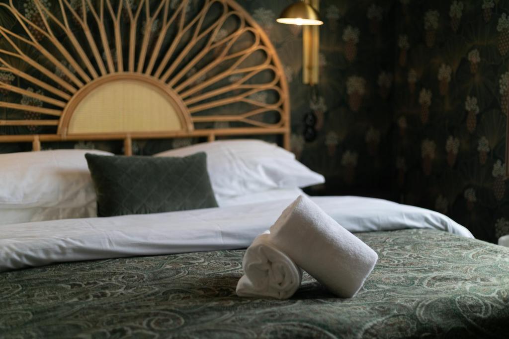 Postel nebo postele na pokoji v ubytování Hotel Siglunes