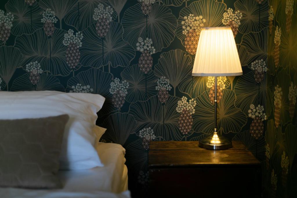 Postel nebo postele na pokoji v ubytování Hotel Siglunes