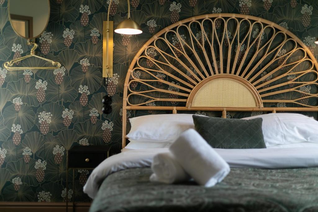 Postel nebo postele na pokoji v ubytování Hotel Siglunes