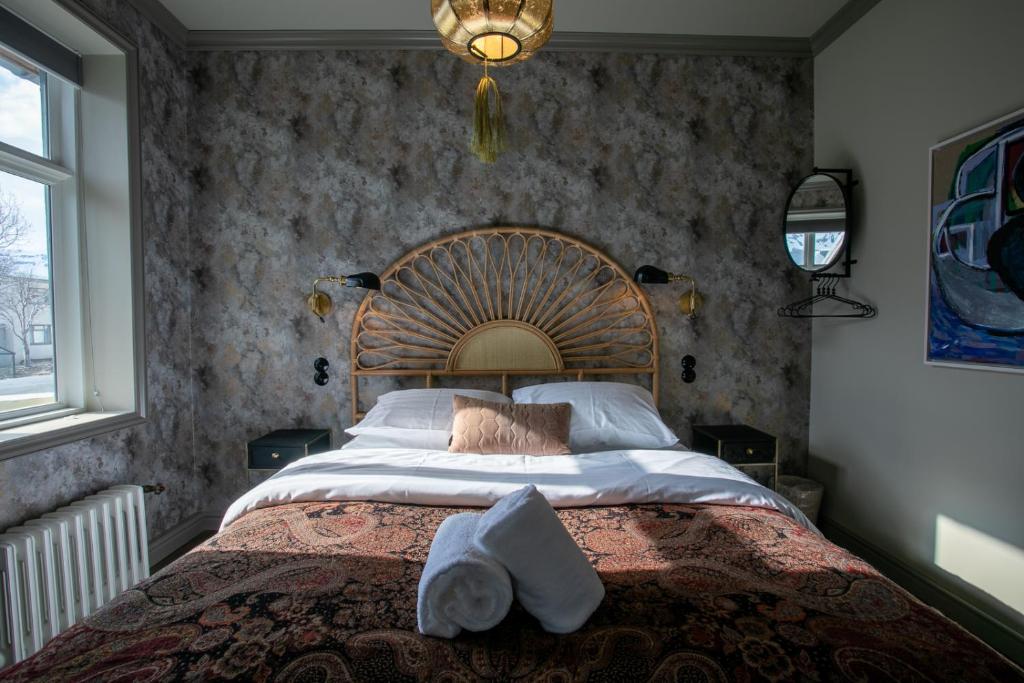 Postel nebo postele na pokoji v ubytování Hotel Siglunes