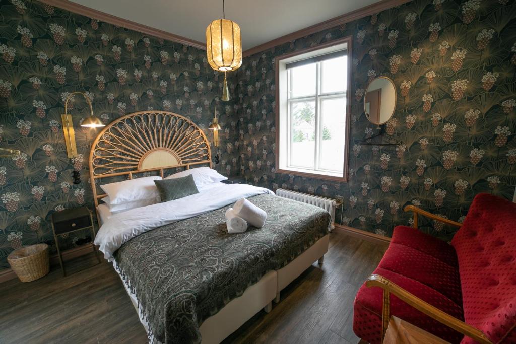 Postel nebo postele na pokoji v ubytování Hotel Siglunes