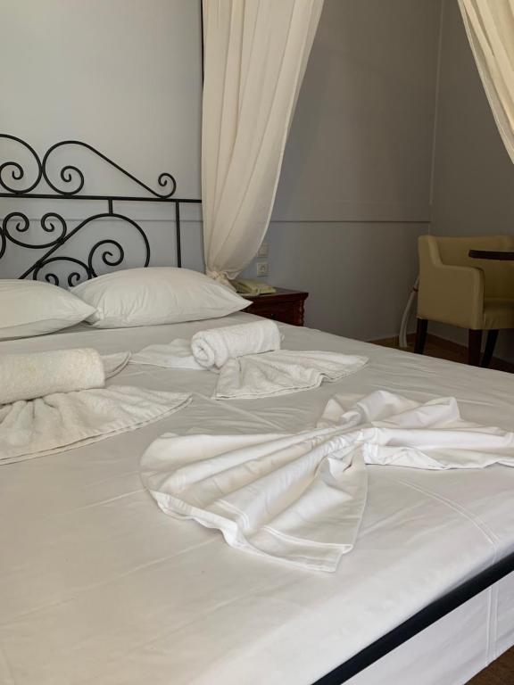 Postel nebo postele na pokoji v ubytování Hotel Notara