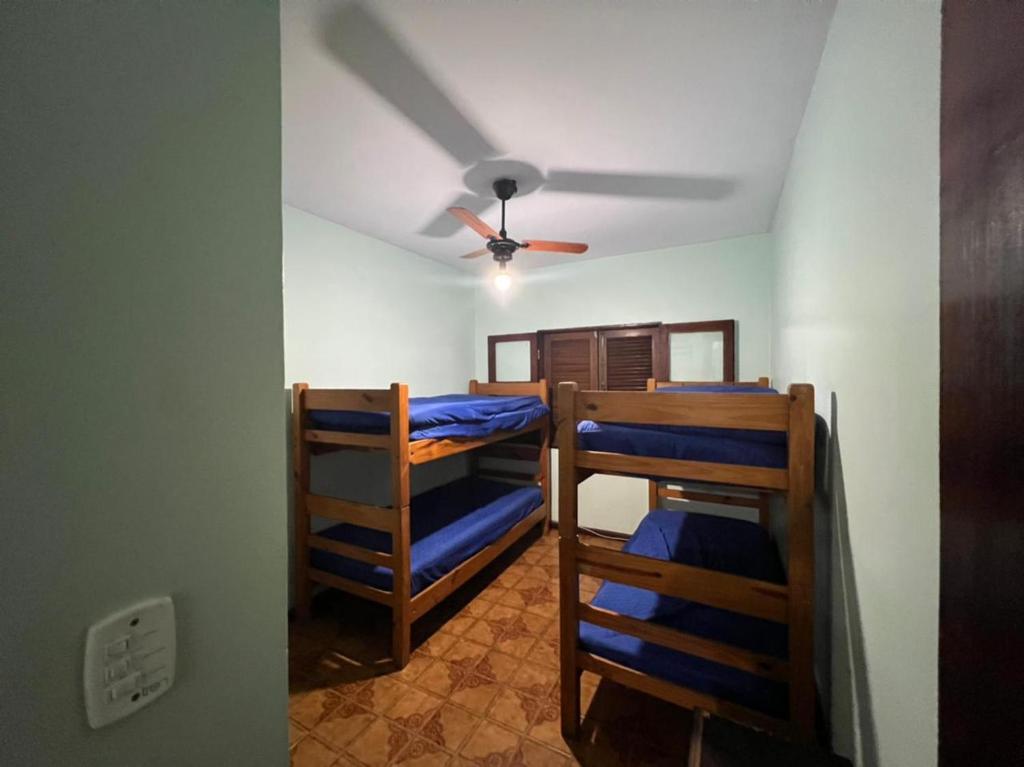 Ένα ή περισσότερα κρεβάτια σε δωμάτιο στο Condomínio - Praia Grande - Ubatuba/SP