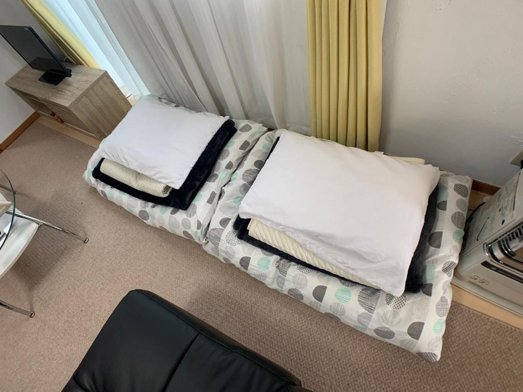 Voodi või voodid majutusasutuse Nagayama Home toas