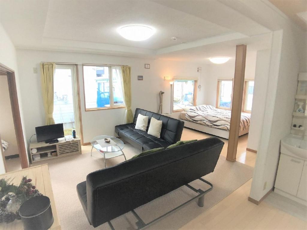 Voodi või voodid majutusasutuse Nagayama Home toas