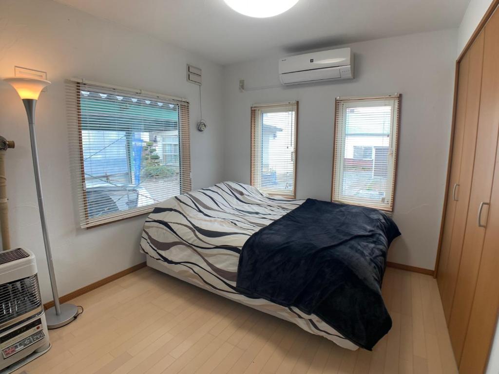 Voodi või voodid majutusasutuse Nagayama Home toas