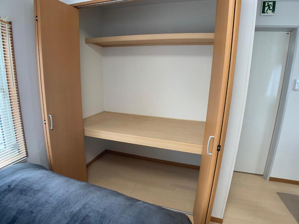 Voodi või voodid majutusasutuse Nagayama Home toas