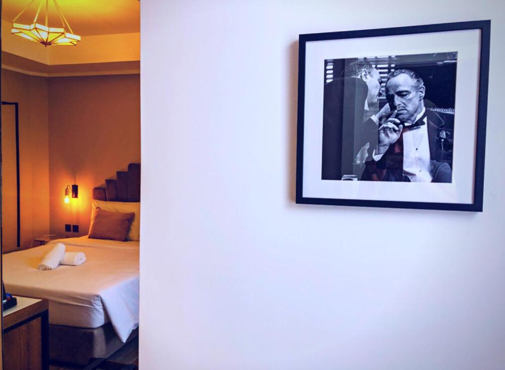 Postel nebo postele na pokoji v ubytování Cinematique