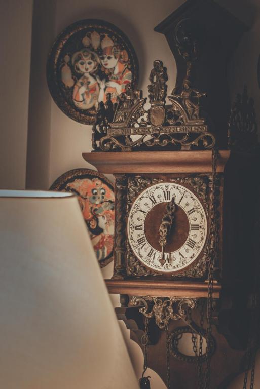 an ornate clock is sitting on a wall at Chrielka Hotel in Limassol