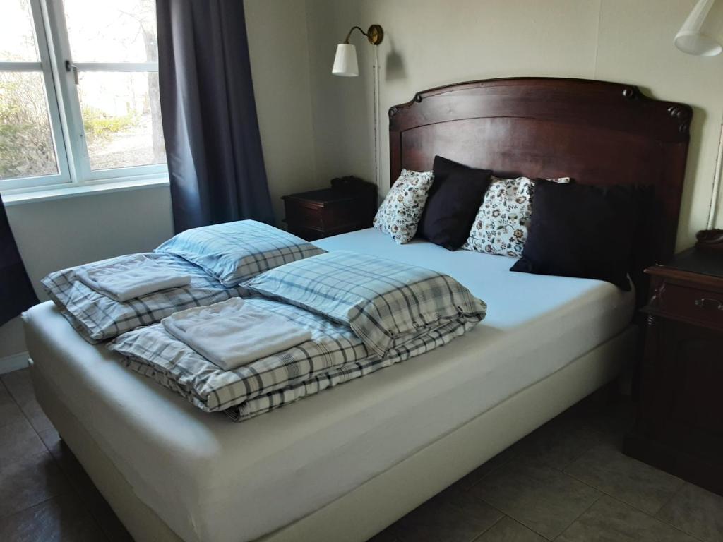 Postel nebo postele na pokoji v ubytování Árbakki Farmhouse Lodge