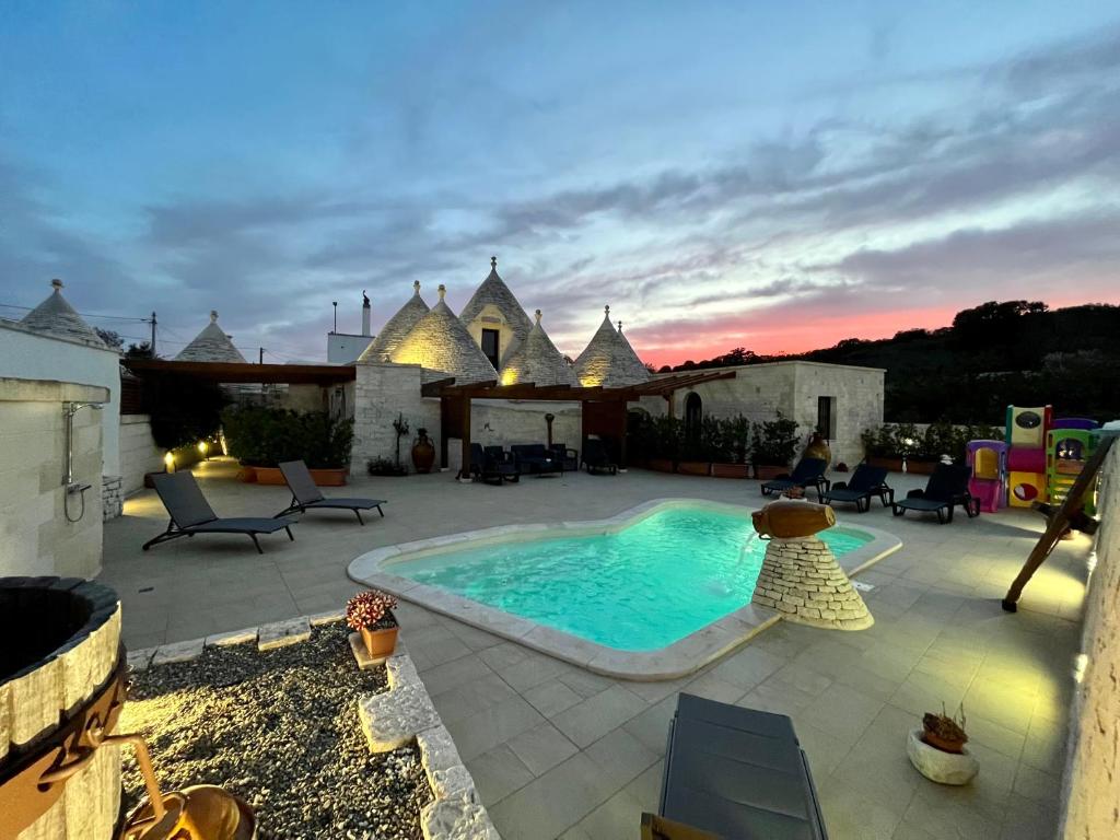 The swimming pool at or close to Quei Trulli Divini