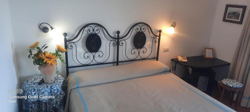 Postel nebo postele na pokoji v ubytování Hotel La Giada del Mesco