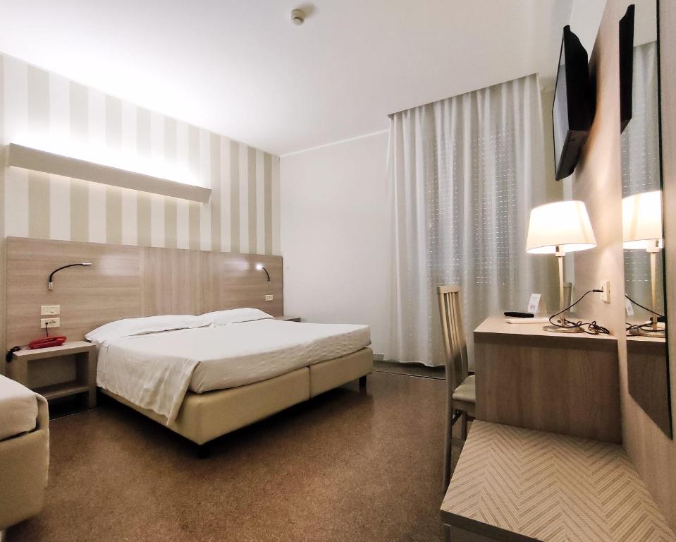 Posteľ alebo postele v izbe v ubytovaní Hotel Vittoria