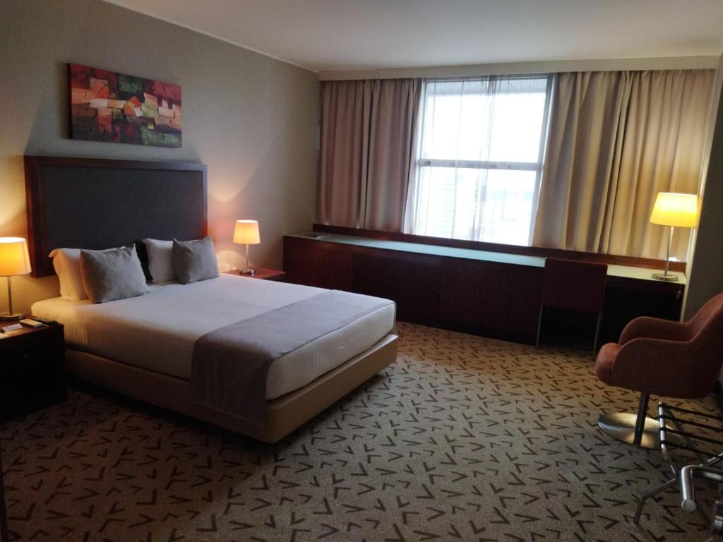 Postel nebo postele na pokoji v ubytování Skyna Hotel Luanda