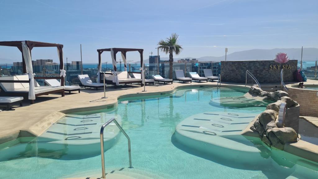 a swimming pool on top of a building at Ocean Spa Plaza Resort Apartment in Gibraltar