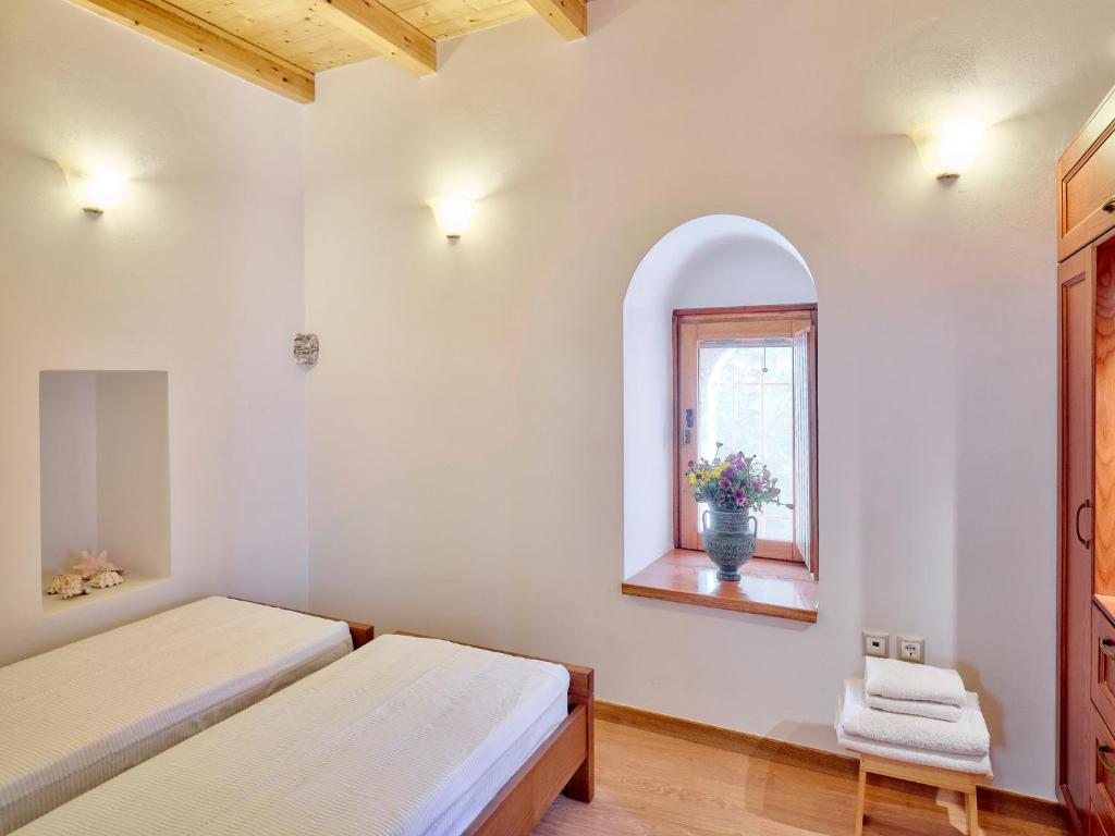 Postel nebo postele na pokoji v ubytování Petreas Castle