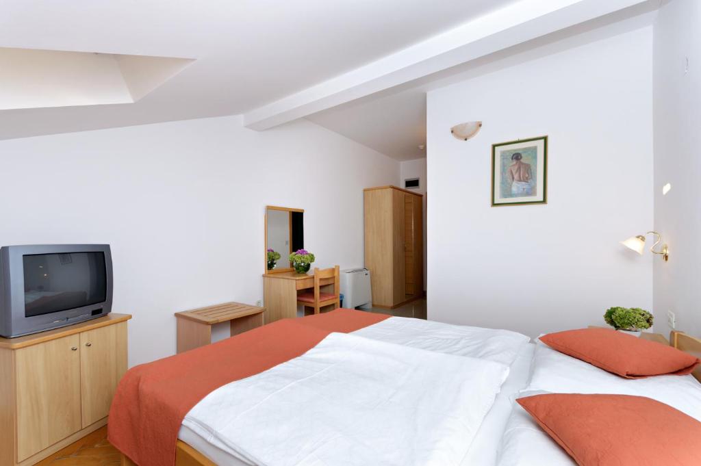 Postel nebo postele na pokoji v ubytování Hotel Epario