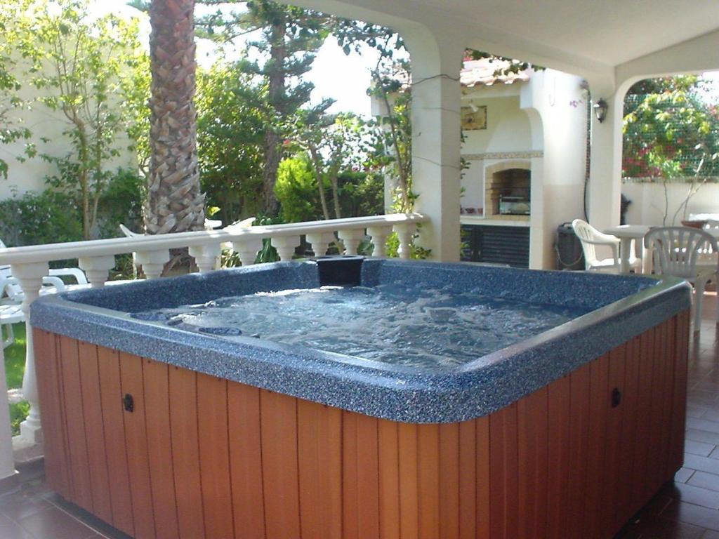 a large hot tub sitting on a patio at Villa Cabanas in Tavira