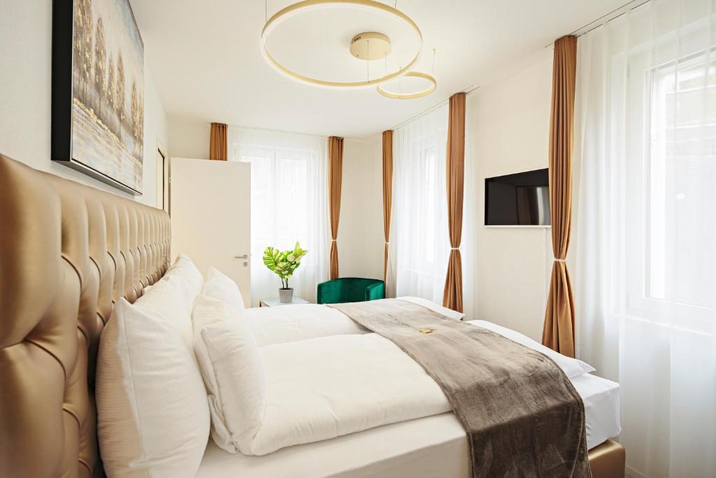 Postel nebo postele na pokoji v ubytování EH Apartments Merkur