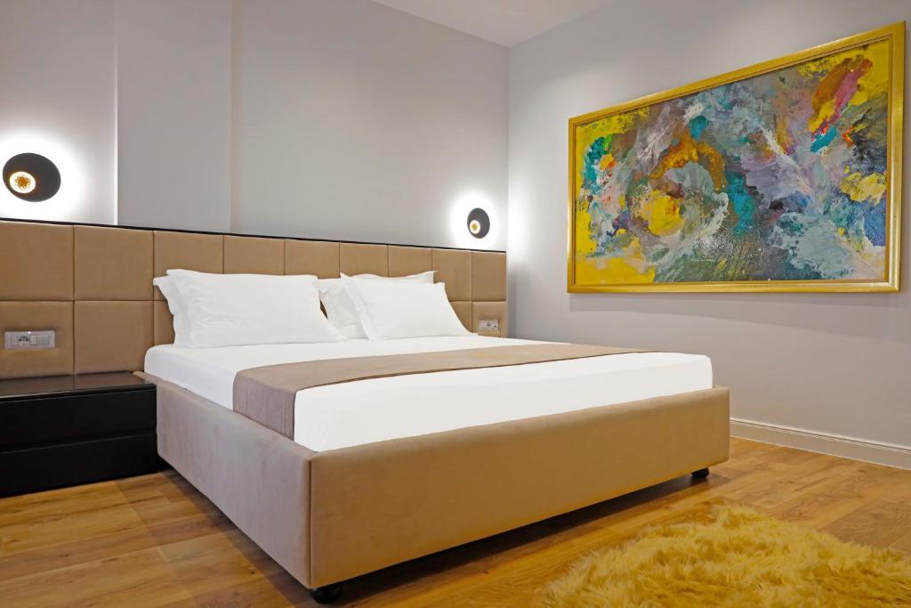 Postel nebo postele na pokoji v ubytování Mark Hotel Tirana