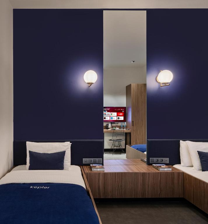 Postel nebo postele na pokoji v ubytování Kepler Club Sabiha Gökçen Airport - International Transit Area
