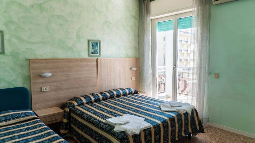 Postel nebo postele na pokoji v ubytování Hotel Bahamas
