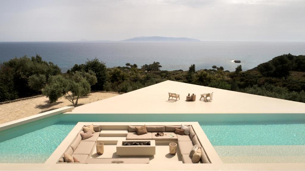 a house with a view of the ocean at Sui Generis Villa in Pesádha