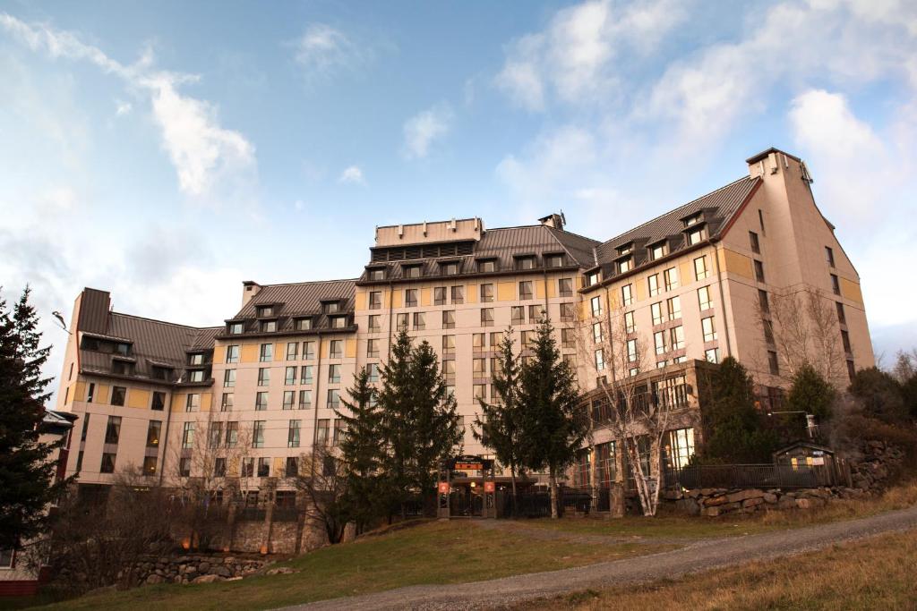 
a large building with a clock on the side of it at Fairmont Tremblant in Mont-Tremblant
