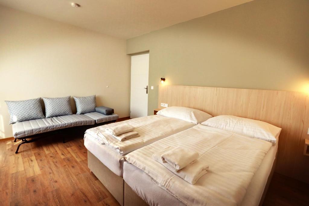 Postel nebo postele na pokoji v ubytování Apartmány Tatra