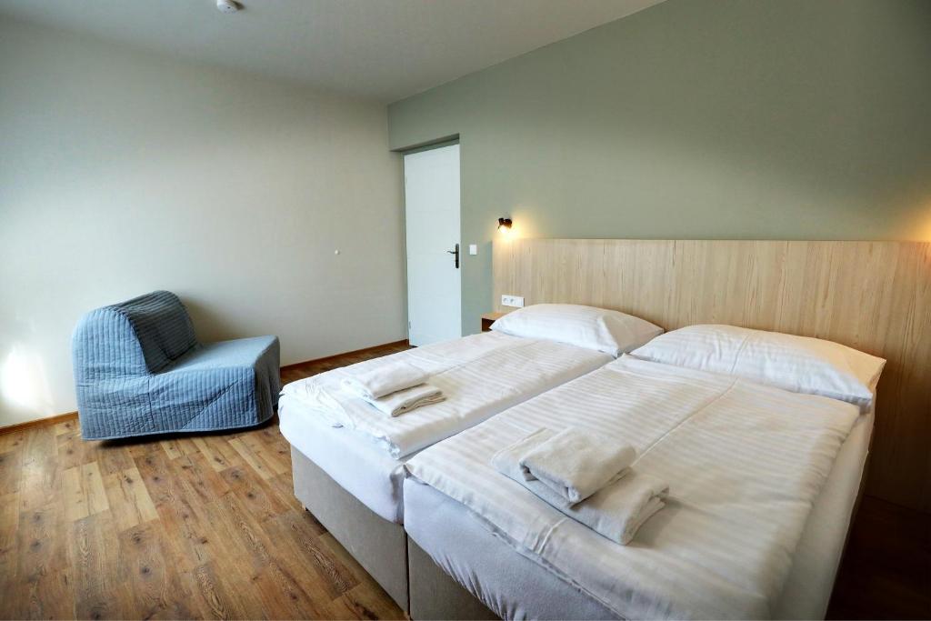 Postel nebo postele na pokoji v ubytování Apartmány Tatra