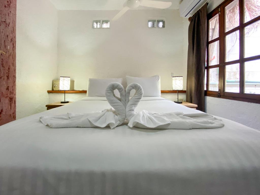 Postel nebo postele na pokoji v ubytování Apart Hotel Casaejido