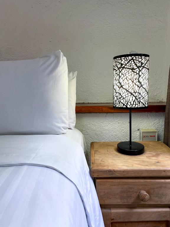 Postel nebo postele na pokoji v ubytování Apart Hotel Casaejido