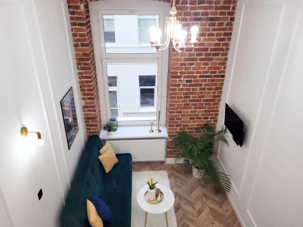TV a/nebo společenská místnost v ubytování Narutowicza 41 Apartments