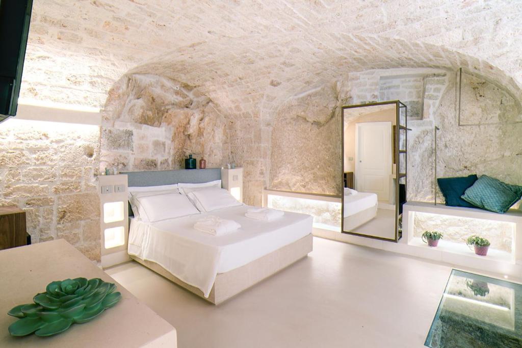 Postel nebo postele na pokoji v ubytování Vico Bianco Raro Smart Rooms Collection