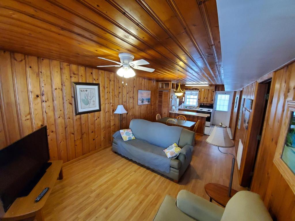 a living room with a couch and a ceiling fan at Atlantic Winds Condos in Myrtle Beach